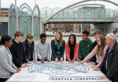 Group of students and Ormiston staff gathered around a Connections: Building Community Bridges installation in an urban public space