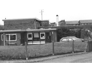 Black and white photograph of the exterior of the first Ormiston family centre, 1981